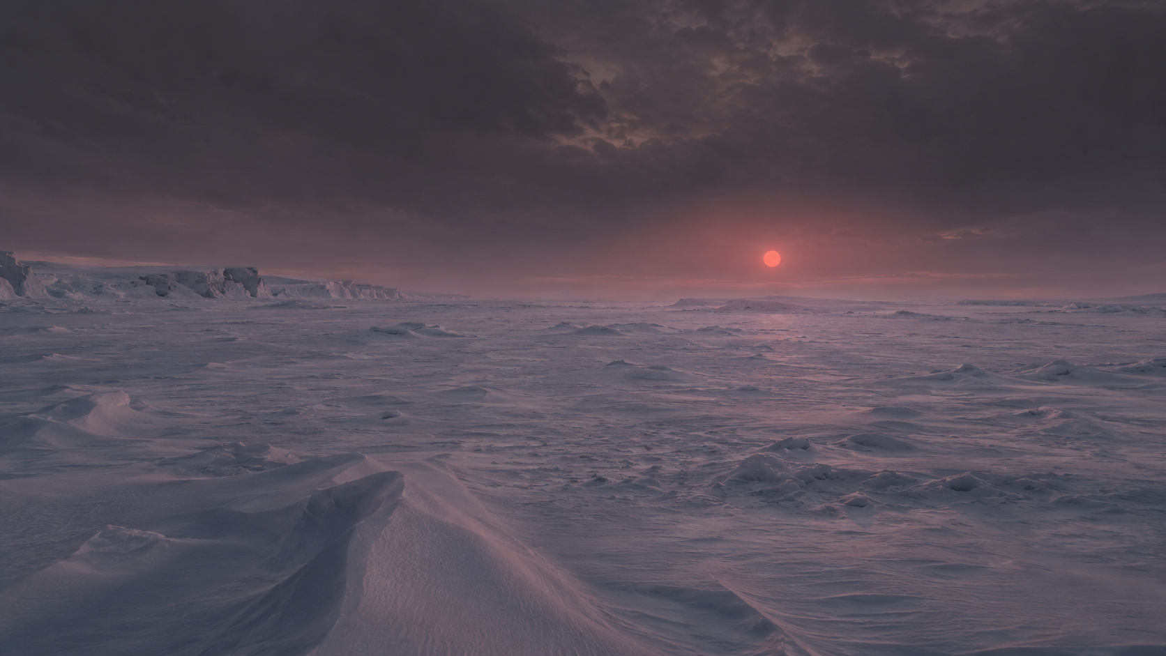 A frozen exoplanet plain under a dim red sun
